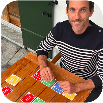 Dad playing Fripouille Fripouille is a fun card game about sustainability promoting sustainable development. The game is an ideal tool for sustainability communication and training